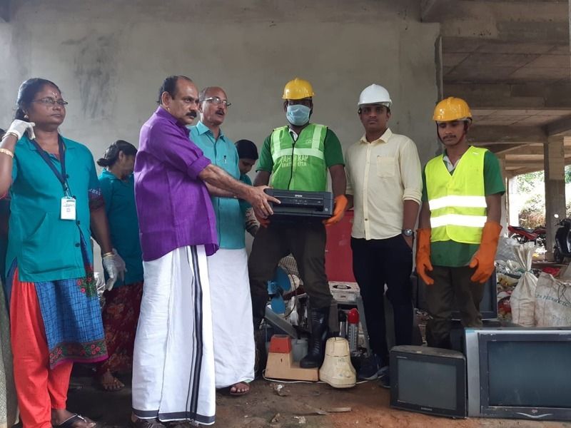 Handing over collected equipment at a panchayat drive